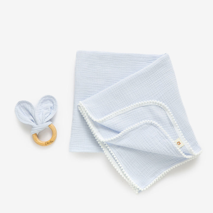 JBØRN Pop Pom Swaddle Organic Muslin Blanket & Teether Set Powder Blue Muslin - Personalisable Baby Products Sold and Personalised by JustBørn